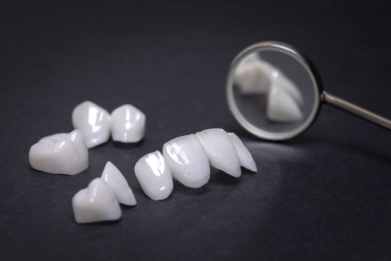 A pair of white teeth sitting on top of a table.